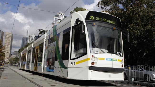 A man was attacked while waiting for a tram in East Brunswick.