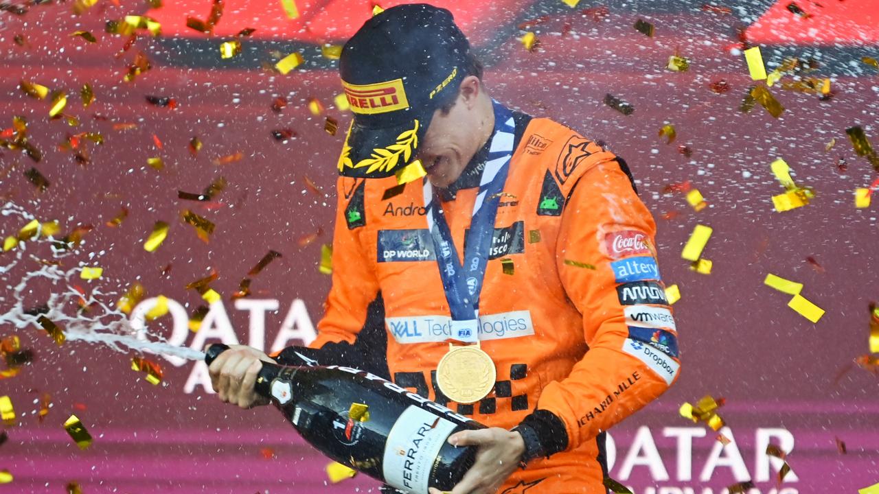 BAKU, AZERBAIJAN - SEPTEMBER 15: Race winner Oscar Piastri of Australia and McLaren celebrates on the podium during the F1 Grand Prix of Azerbaijan at Baku City Circuit on September 15, 2024 in Baku, Azerbaijan. (Photo by James Sutton/Getty Images)