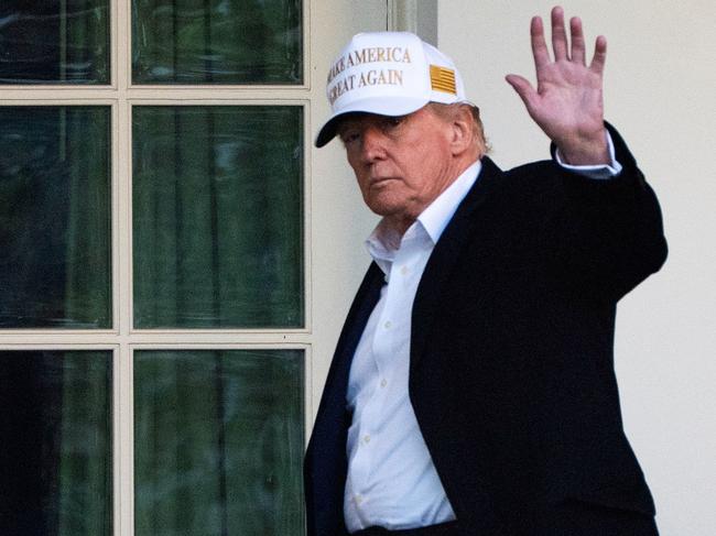 President Donald Trump waves outside the Oval Office as he arrives at the White House, Sunday, April 27, 2025, in Washington. (AP Photo/Manuel Balce Ceneta)