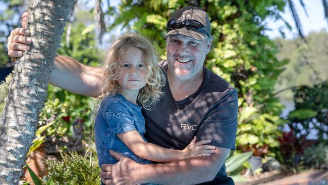 Beau with his father Ben Blake, who ripped the snake off his son’s leg. Picture: Danielle Smith