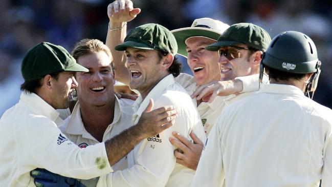 Shane Warne, Adam Gilchrist and Ricky Ponting celebrate a wicket.