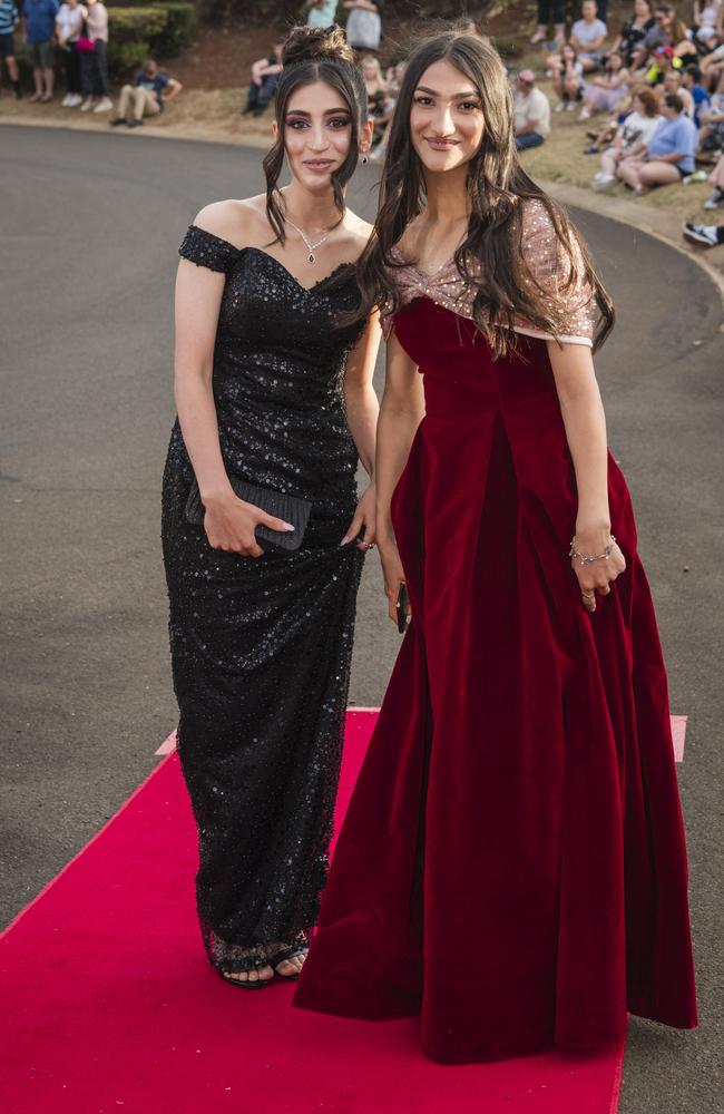 Holia Omar (left) and Salma Sulaiman at Harristown State High School formal at Highfields Cultural Centre, Friday, November 17, 2023. Picture: Kevin Farmer