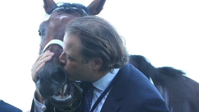 Tom Magnier gives Shinzo a kiss after the Slipper.