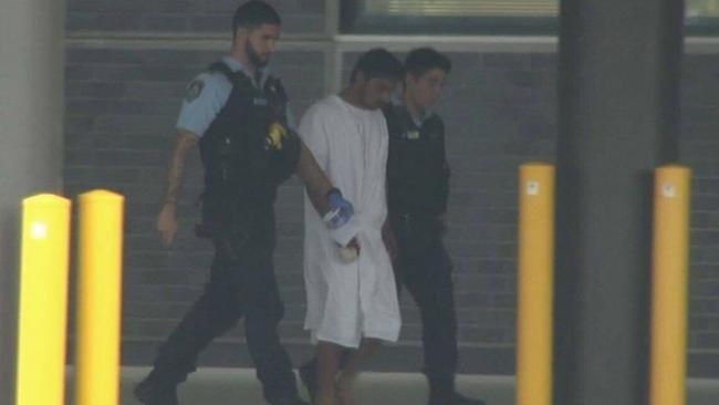 Police escort Baltej Lailna, accused of murdering his wife, to hospital. Picture: Twitter