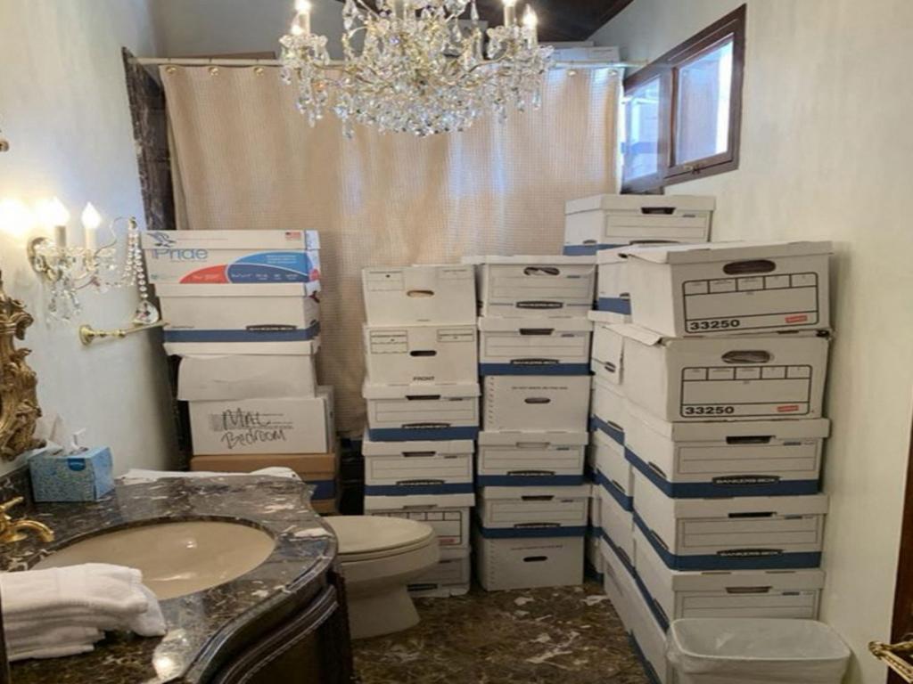 A photo used evidence in the indictment against Donald Trump, shows stacks of boxes in a bathroom and shower allegedly in the Lake Room at Mar-a-Lago. Picture: AFP