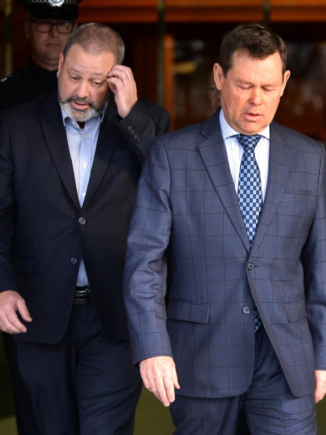 Nicole Tucker’s husband Brett Tucker (left) and brother Kent Thiele leave court after sentencing. Picture: Greg Higgs