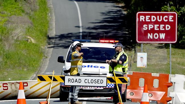 A roadblock is seen at Miles Street in Coolangatta on the Gold Coast. Stronger barriers have been installed to enforce the border separation between Queensland and New South Wales after motorists navigated around previous installed barriers. (AAP Image/Dave Hunt)