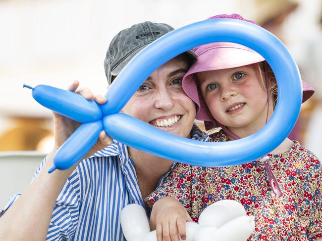 Rachel Wise and daughter Margot Wise play with balloon sculptures at Fairholme Spring Fair, Saturday, October 19, 2024. Picture: Kevin Farmer