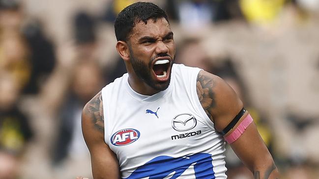 MELBOURNE, AUSTRALIA - AUGUST 19: Tarryn Thomas of the Kangaroos celebrates kicking a goal during the round 23 AFL match between Richmond Tigers and North Melbourne Kangaroos at Melbourne Cricket Ground, on August 19, 2023, in Melbourne, Australia. (Photo by Daniel Pockett/Getty Images)