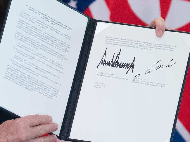 The short agreement signed by the two leaders at the Capella Hotel on Singapore’s Sentosa Island contained few specifics. Picture: AFP Photo / Saul Loeb