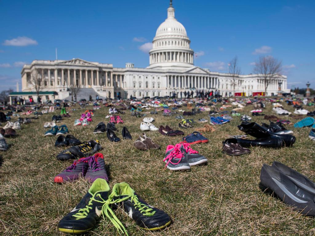 The lawn outside the US Capitol is covered with 7,000 pairs of empty shoes to memorialise the 7,000 children killed by gun violence since Sandy Hook (March 13, 2018). Picture: AFP 