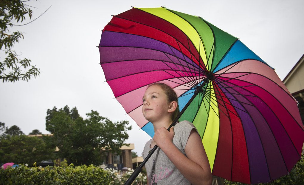 Elise Cumner shelters from the rain at Fairholme Spring Fair at the weekend. Picture: Kevin Farmer