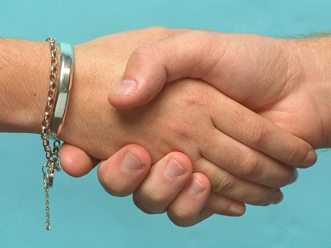 MARCH 1, 2002 : Generic photo of two people shaking hands, 01/03/02. Pic Steve Morenos.Hand Shake