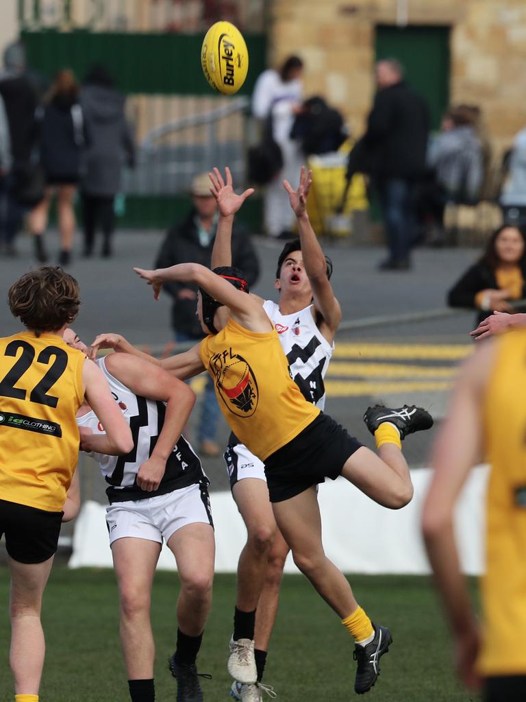 Under 16 Boys STJFL vs. NTJFA match, North Hobart Oval: North's James Wallace looks to mark the ball. Picture: LUKE BOWDEN