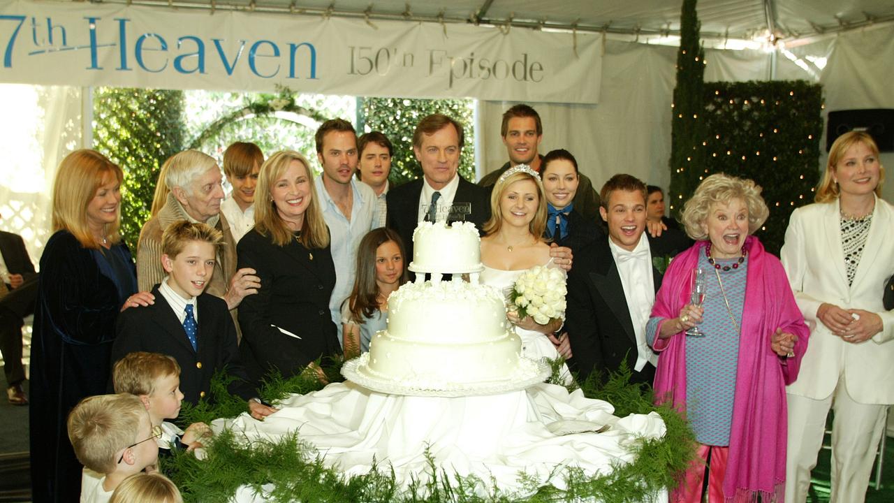 The cast and producers pose at a 2003 reception to celebrate 150 episodes of 7th Heaven. Picture: Kevin Winter/Getty Images