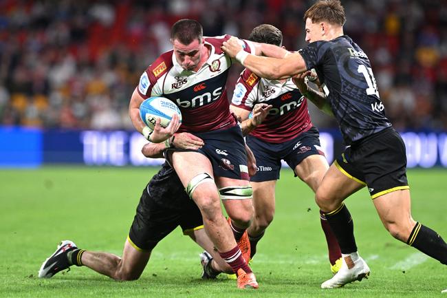 BRISBANE, AUSTRALIA - MAY 23: Joe Brial of the Reds takes on the defence during the round 15 Super Rugby Pacific match between Queensland Reds and Hurricanes at Suncorp Stadium, on May 23, 2025, in Brisbane, Australia. (Photo by Bradley Kanaris/Getty Images)