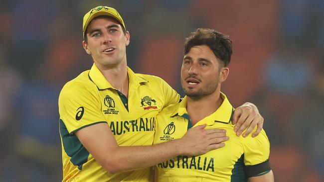 AHMEDABAD, INDIA - NOVEMBER 04: Marcus Stoinis and Pat Cummins of Australia celebrates the wicket of Chris Woakes of England during the ICC Men's Cricket World Cup India 2023 between England and Australia at Narendra Modi Stadium on November 04, 2023 in Ahmedabad, India. (Photo by Robert Cianflone/Getty Images)