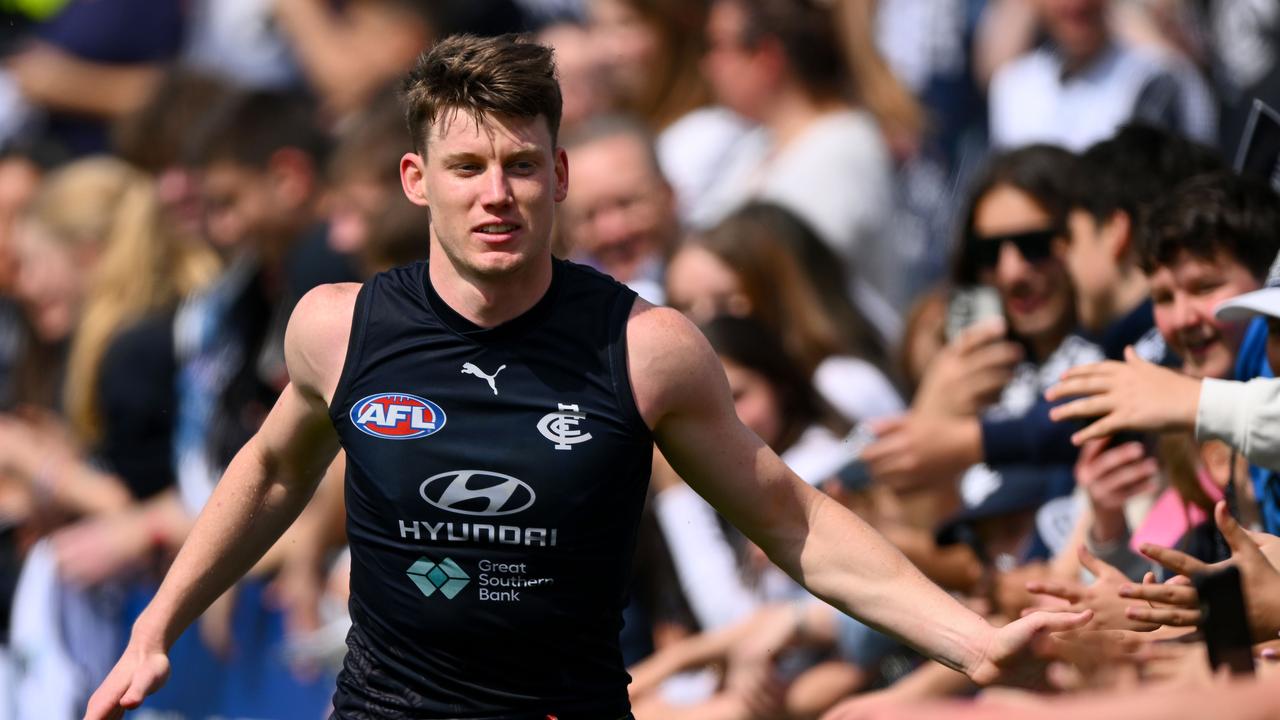 Sam Walsh of the Blues greets fans. Picture: Morgan Hancock/Getty Images