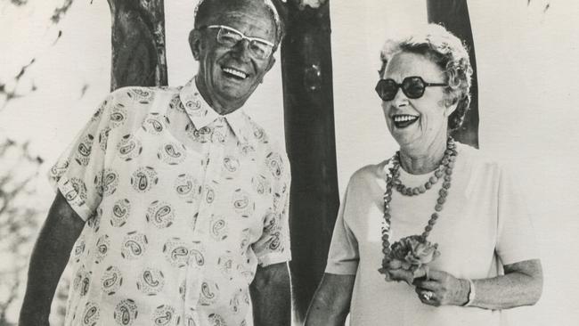 Always the loving couple, Gold Coast Mayor Bruce Small and Mayoress Lillian Small stand together in 1973 with their beloved pet Mimi in the gardens of their private island Bruce built up from mangrove swamp, behind Surfers Paradise at Isle of Capri.