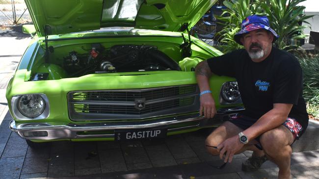 Ipswich's Kevin Stoddart with his 1971 HQ wagon with the number plates GASITUP. Photo: Pam McKay