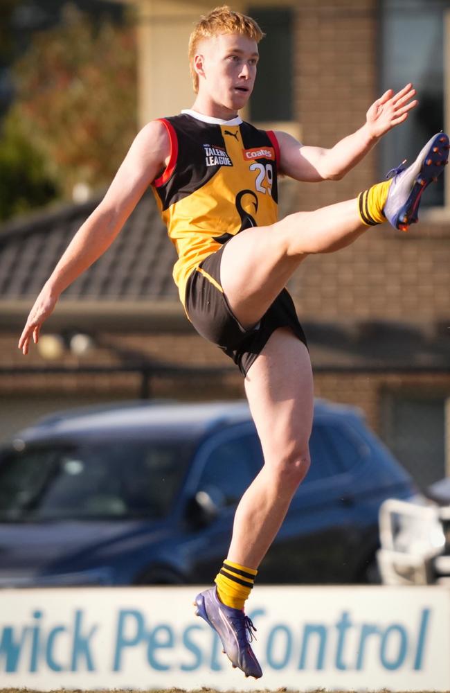 Callum Smith takes a kick for Dandenong Stingrays. Pic: Blackboot Photography.
