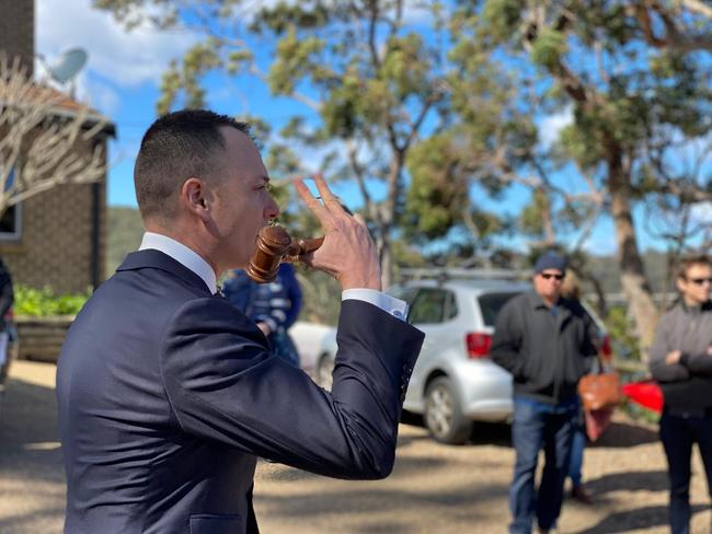 Auctioneer Andrew Cooley at the sale of a Gymea Bay house on Saturday, February 6, 2021. NSW real estate.