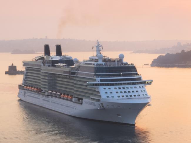 Celebrity Cruises cruise ship Solstice approaches Sydney Opera House and Sydney Harbour on a summer morning at sunrise.Photo - iStockESCAPE27 FEBRUARY 2022CRUISE