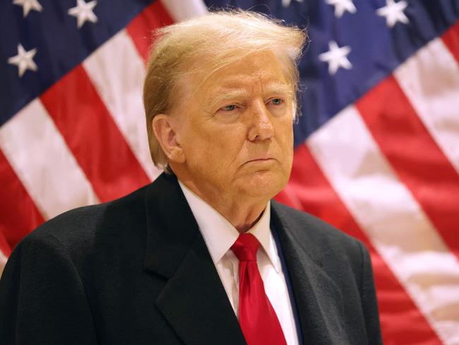 NEW YORK, NEW YORK - MARCH 25: Former President Donald Trump listens as his attorney Todd Blanche speaks during a press conference at 40 Wall Street after a pre-trial hearing on March 25, 2024 in New York City. Judge Juan Merchan scheduled Trump's criminal trial to begin on April 15, which would make it the first criminal prosecution of a former American president. Trump was charged with 34 counts of falsifying business records last year, which prosecutors say was an effort to hide a potential sex scandal, both before and after the 2016 election.   Michael M. Santiago/Getty Images/AFP (Photo by Michael M. Santiago / GETTY IMAGES NORTH AMERICA / Getty Images via AFP)