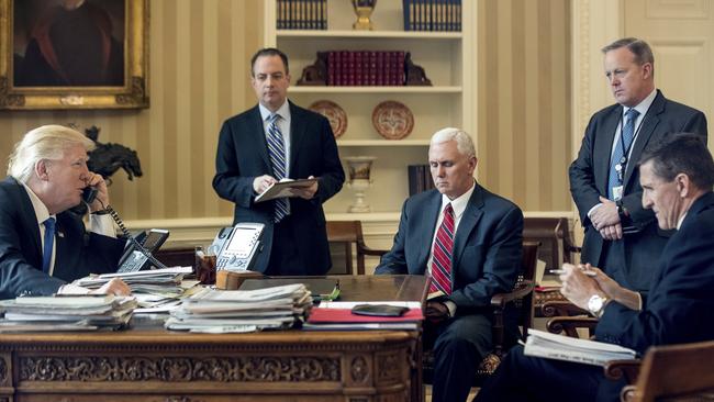 President Donald Trump accompanied by Chief of Staff Reince Priebus, Vice President Mike Pence, White House press secretary Sean Spicer and National Security Adviser Michael Flynn speaks on the phone with Russian President Vladimir Putin in the Oval Office at the White House in Washington in January 2017. Picture: AP /Andrew Harnik.