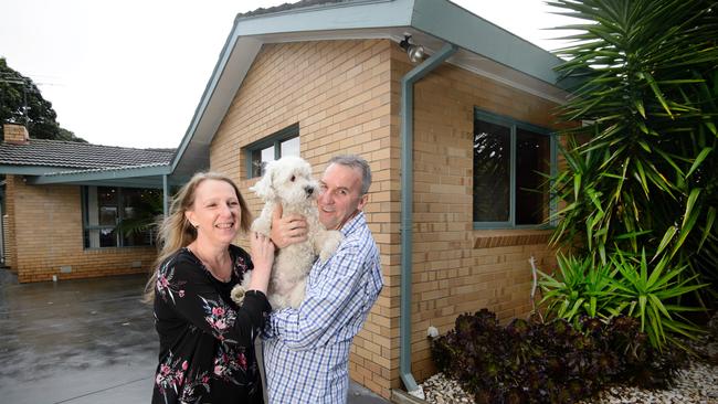 Greg and Danielle Clarke, pictured with their dog Rolo, are selling their house in family hot spot Cheltenham. Picture: Jay Town