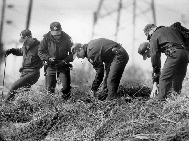 Searchers sift through the area where the remains of Karmein Chan were found in a remote area in Thomastown.