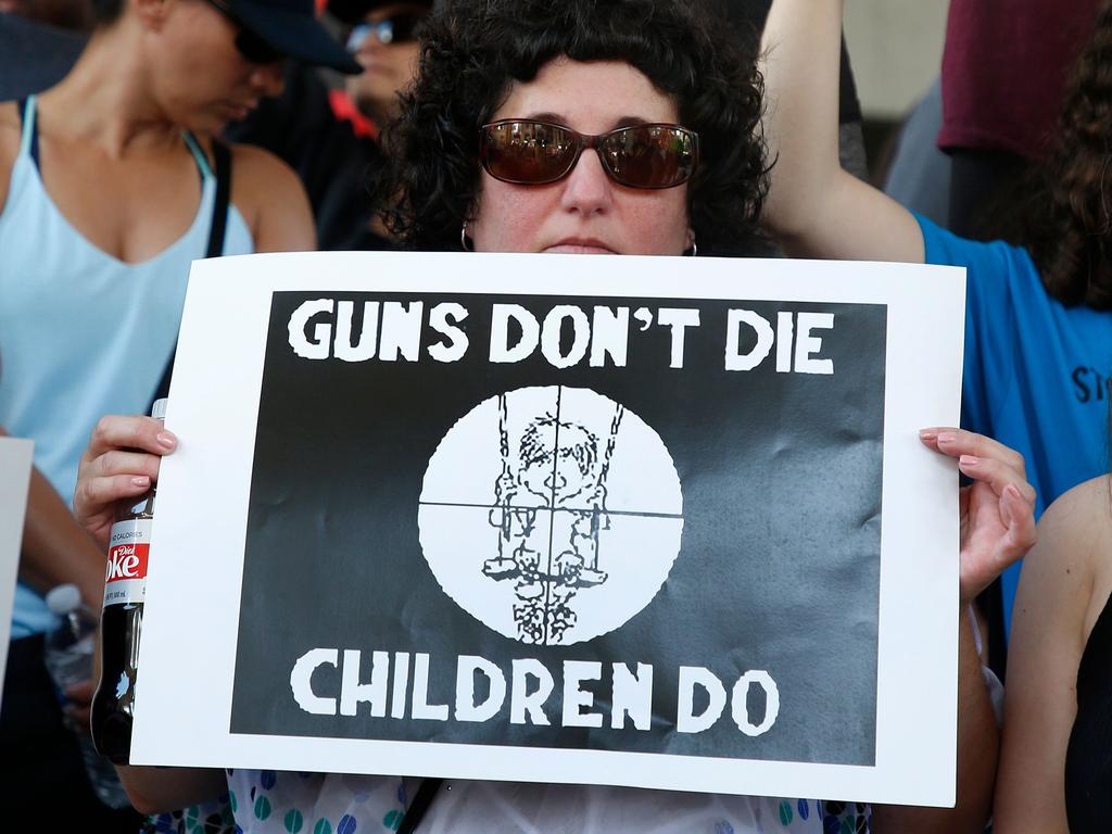 Protesters hold signs at a rally for gun control after 17 perished and more than a dozen were wounded in the hail of bullets at Marjory Stoneman Douglas High School. Picture: AFP