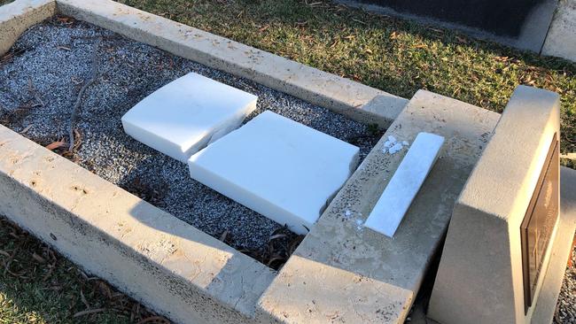 Vandals damaged 23 graves, including this one of a soldier. Picture: Jim O'Rourke