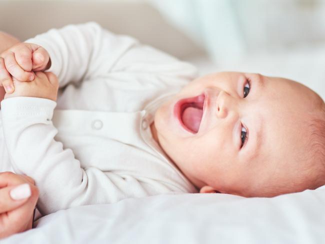 Shot of an adorable baby boy bonding with his mother at home