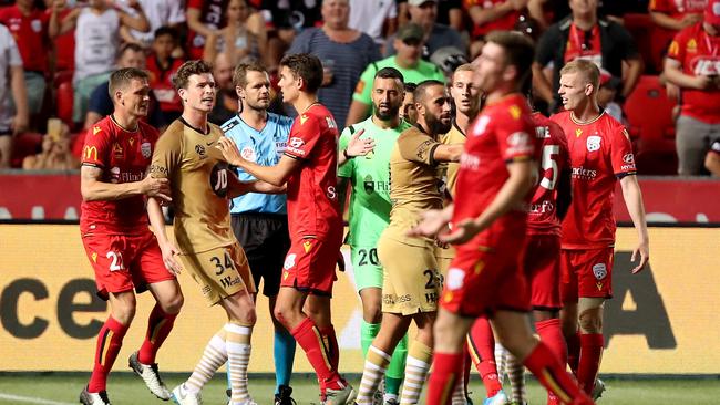 Referee Chris Beath watches Adelaide United and Western Sydney Wanderers get heated at Coopers Stadium on Friday. (AAP Image/James Elsby)