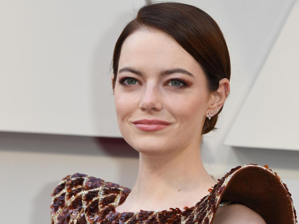 Emma Stone flashes a diamond ring on her wedding finger suggesting she may  already be engaged