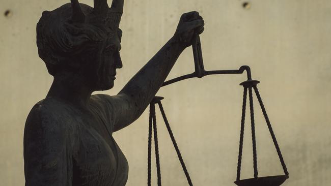 BRISBANE , AUSTRALIA - NewsWire Photos - BRISBANE , JUNE 24 2024: Generic photo of the scales of justice stature outside Brisbane Supreme Court in the Brisbane CBD. Picture: NewsWire / Glenn Campbell