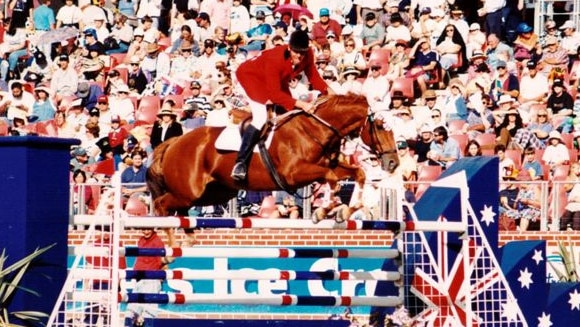 Equestrian Anthony Thomas and his previous horse, Fluke, in action.