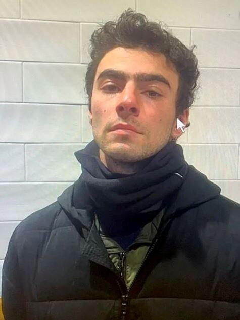 Luigi Mangione, 26, in a police mugshot taken hours after his arrest at a Pennsylvania McDonald's.