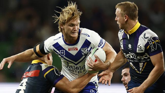 MELBOURNE, AUSTRALIA - MARCH 11: Jacob Preston of the Bulldogs is tackled by Young Tonumaipea of the Storm during the round two NRL match between the Melbourne Storm and Canterbury Bulldogs at AAMI Park on March 11, 2023 in Melbourne, Australia. (Photo by Daniel Pockett/Getty Images)