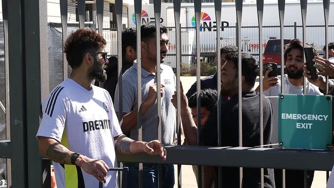 Kohli talks with fans through the fence after batting in the nets at Optus Stadium. Picture: Getty Images