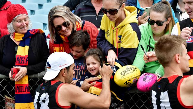 Eddie Betts signs autographs for fans at Adelaide Crows training at Football Park, West Lakes. Picture: Bianca De Marchi