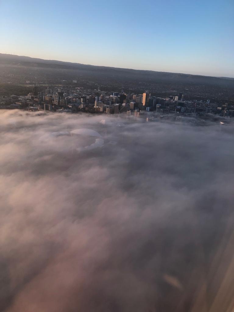 Low cloud and fog over Adelaide, seen from a Melbourne-Adelaide Qantas flight. The flight was diverted back to Melbourne. Picture: Darren Watson