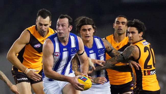 Todd Goldstein emerges from a pack of players during North Melbourne’s clash with Hawthorn.