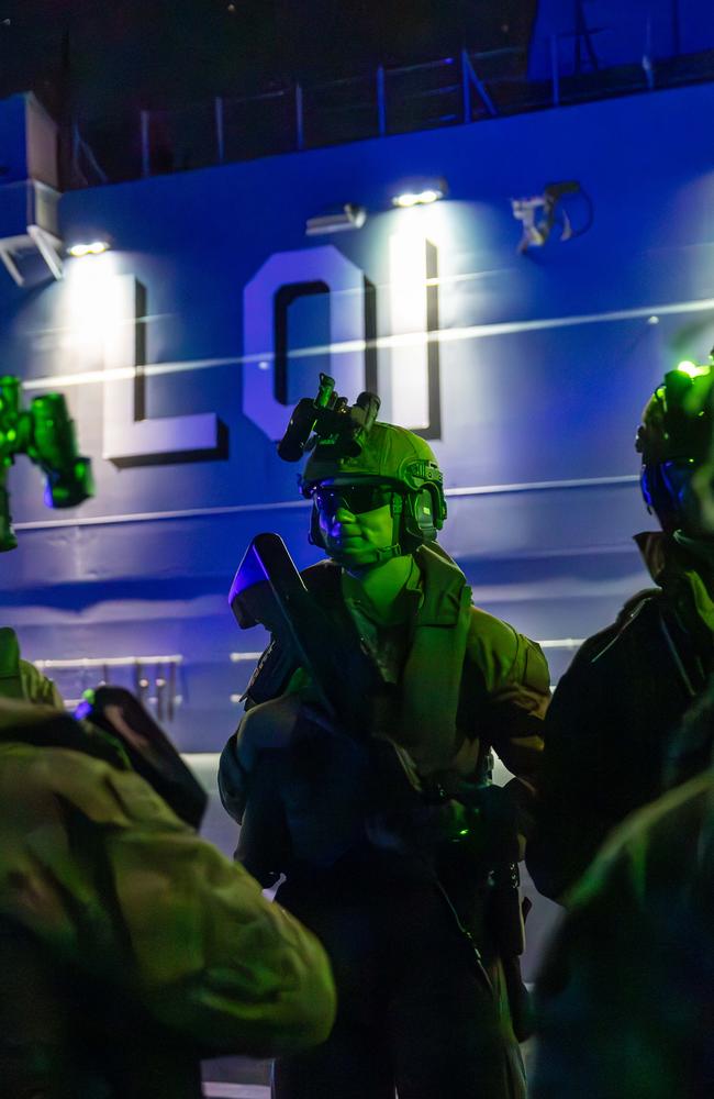 Soldiers from the Australian Amphibious Force conduct an Assault Route rehearsal by night on the Helicopter Landing Dock of HMAS Adelaide during Wet and Dry Environmental Rehearsals. Picture: Captain Annie Richardson