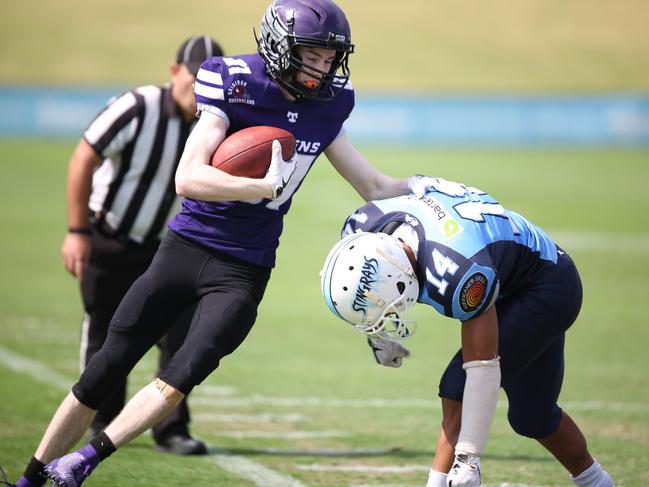 NIMBLE: Bayside Ravens wide receiver Warwick "Bones" Russell on the charge in Queensland's peak American football competition. Photo: Nikki Verbakel, Touchdown Photography