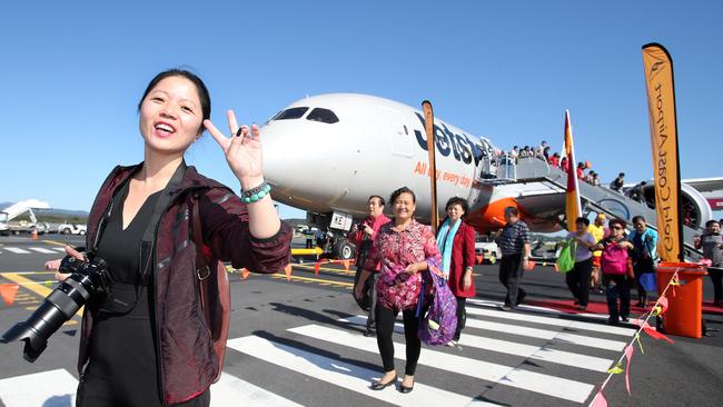 The Hong Kong flights come just months after the arrival of the first direct flight from Wuhan China to the Gold Coast. Tourist Lily Ying was among the first to land on the tarmac. Picture: Richard Gosling