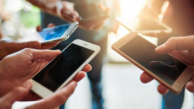 Matthew Flinders Anglican College has banned the use of mobile phones in an effort to encourage students to socialise face-to-face. Picture: PeopleImages