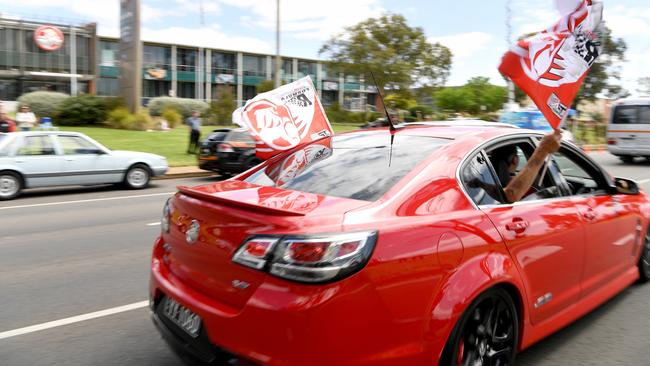 A Commodore passes the former Holden plant at Elizabeth, SA, on the last day of its operation in 2017. Picture: Tricia Watkinson