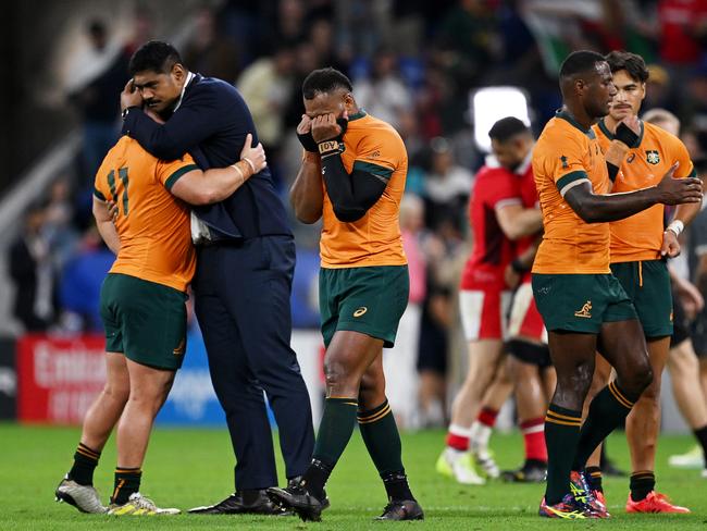 LYON, FRANCE - SEPTEMBER 24: Will Skelton of Australia consoles Blake Schoupp of Australia whilst Samu Kerevi of Australia looks dejected at full-time following the Rugby World Cup France 2023 match between Wales and Australia at Parc Olympique on September 24, 2023 in Lyon, France. (Photo by Hannah Peters/Getty Images)